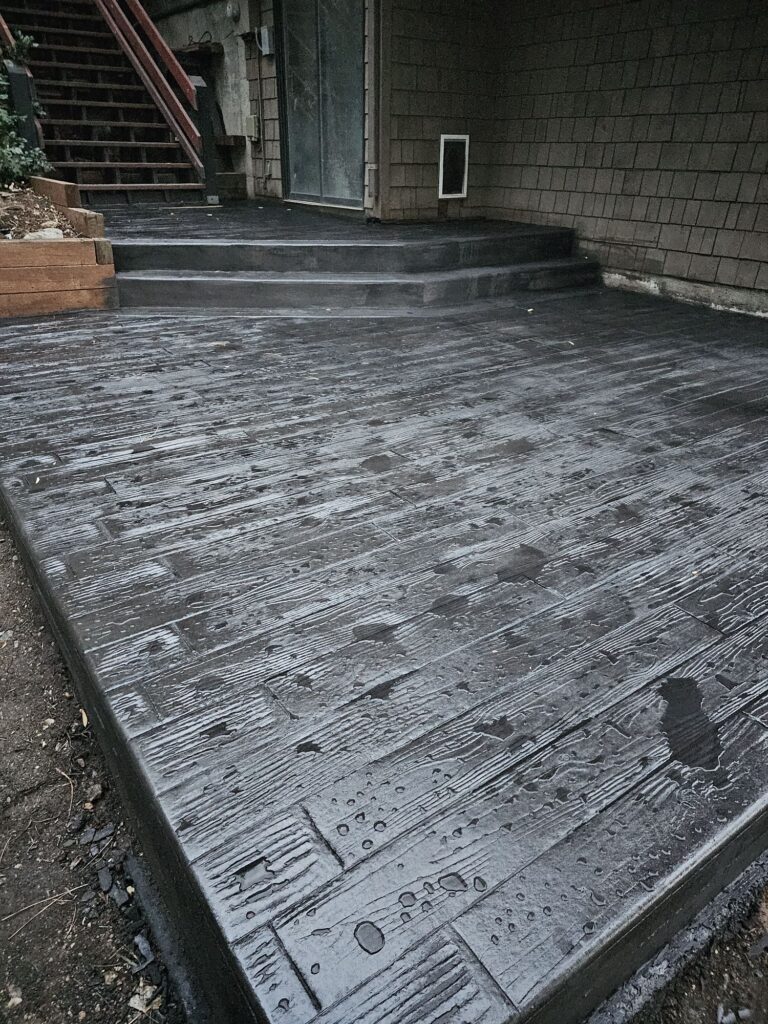 Black timber wood plank stamped concrete patio, davis color graphite steps